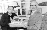 Tewi Nicholls (left) and Arthur Reid with artefacts